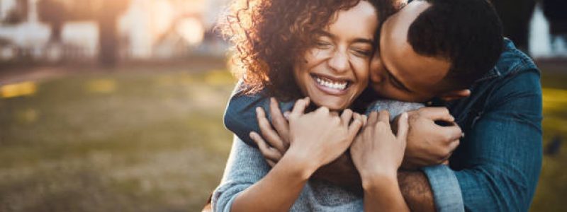 Shot of an affectionate young couple bonding together outdoors